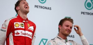 Nico Rosberg (r.) war vom Vettel-Sieg durchaus überrascht Rosberg, Vettel
